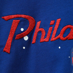 Nike Philadelphia 76ers Women's Courtside Splatter Cropped T-Shirt Royal